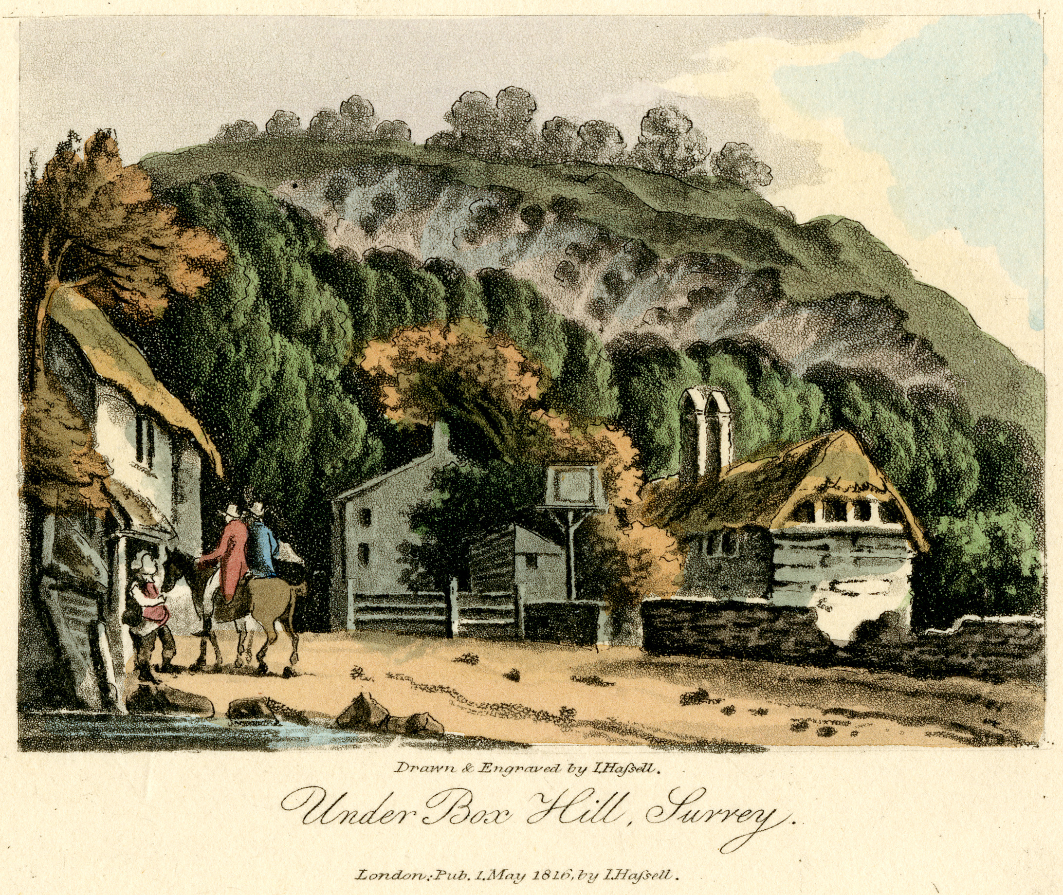 Hand-coloured aquatint titled ‘Under Box Hill, Surrey,’ showing cottages and riders beneath the wooded chalk slope of Box Hill at Mickleham.